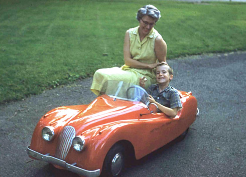 Hal Chaffee's younger brother and mother with the Jaguar XKE 120 in 1957
