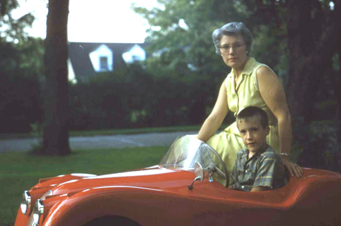 Hal Chaffee's younger brother and mother with the Jaguar XKE 120 in 1957