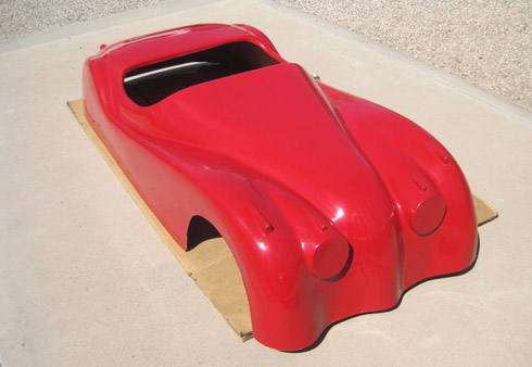 Red Fiberglass body of the American Junior XKE 120 car produced around 1955
