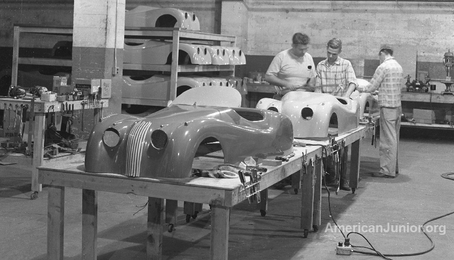 Assembling the Jaguar XKE 120 fiberglass body at the American Junior plant in Portland, Oregon around 1955