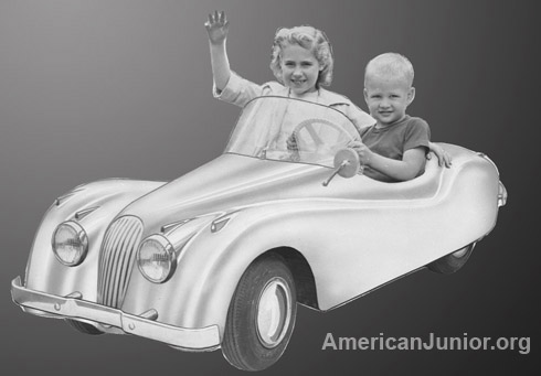 Avvertising still of kids riding the American Junior Jaguag XKE 120 car